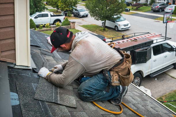 Professional Roofing technician working in Sandston, VA